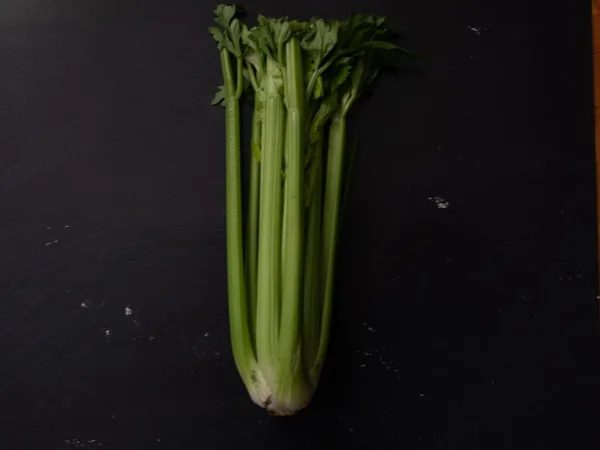 green vegetable on black table