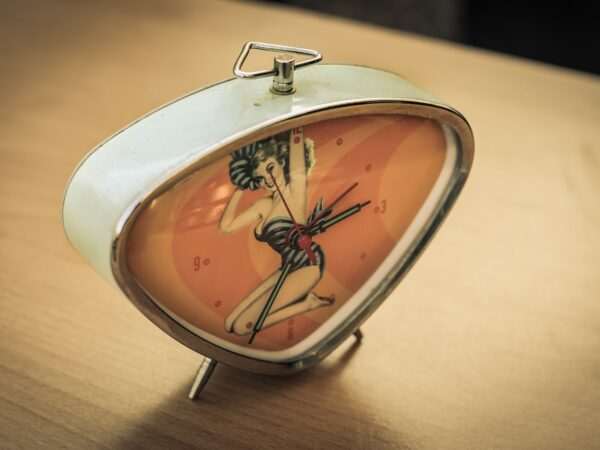 white and red alarm clock