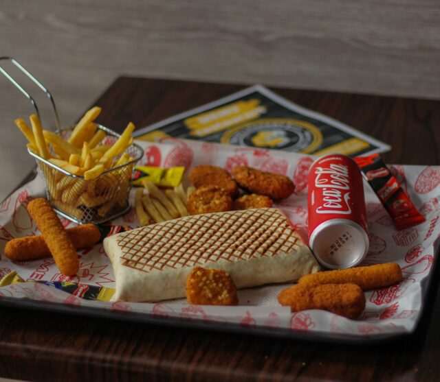 Photo by Khalid Boutchich 1 burger and fries on tray