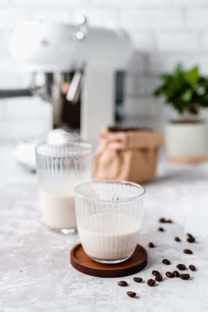 white liquid in clear drinking glass