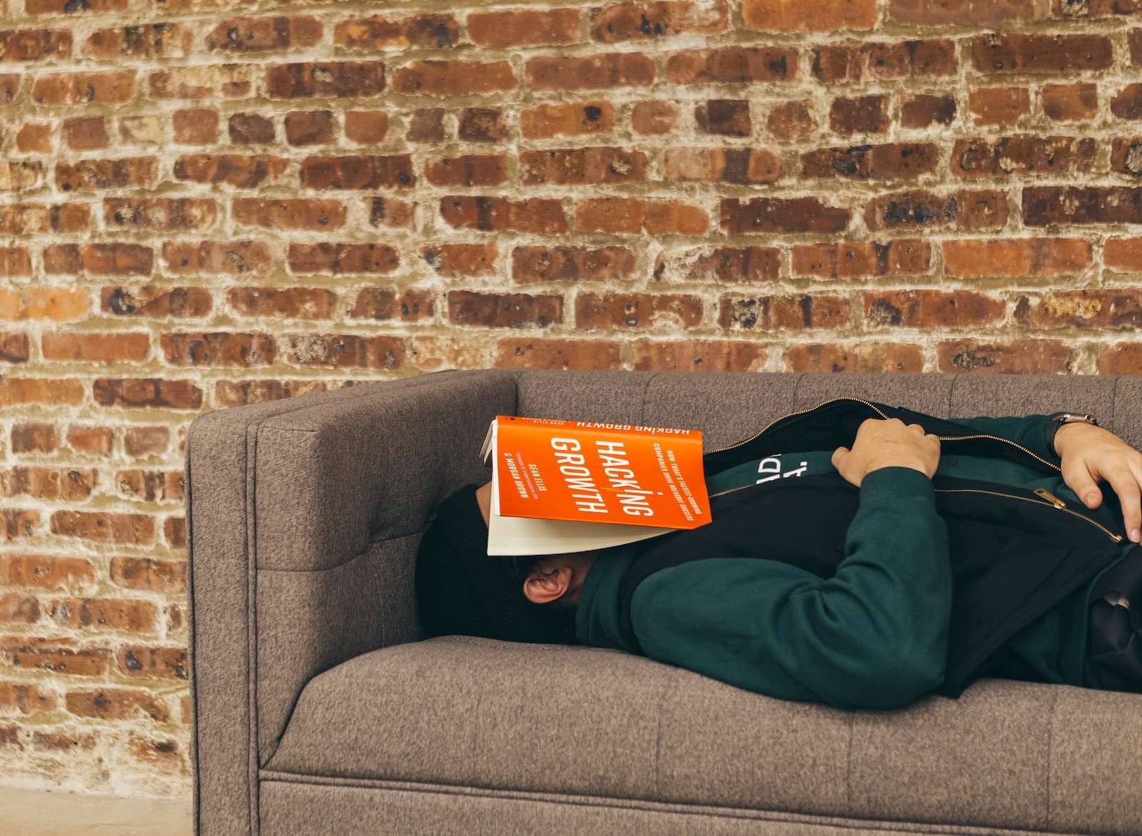Photo by No Revisions person sleeping on sofa near the wall