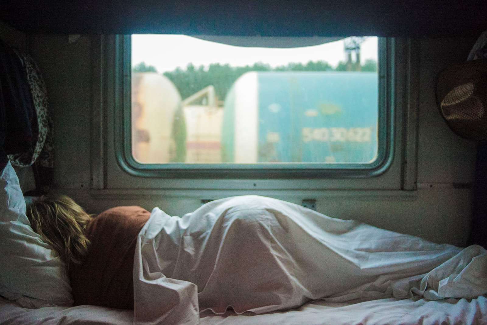 Photo by Михаил Калегин woman sleeping on trailer
