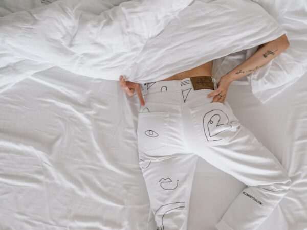How To Get Rid Of The Habit Of Sleeping Late? 2 woman in white dress lying on bed