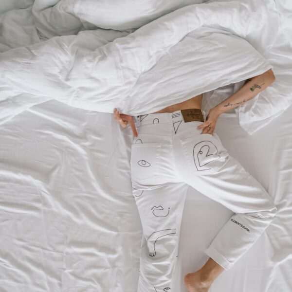 How To Get Rid Of The Habit Of Sleeping Late? 31 woman in white dress lying on bed