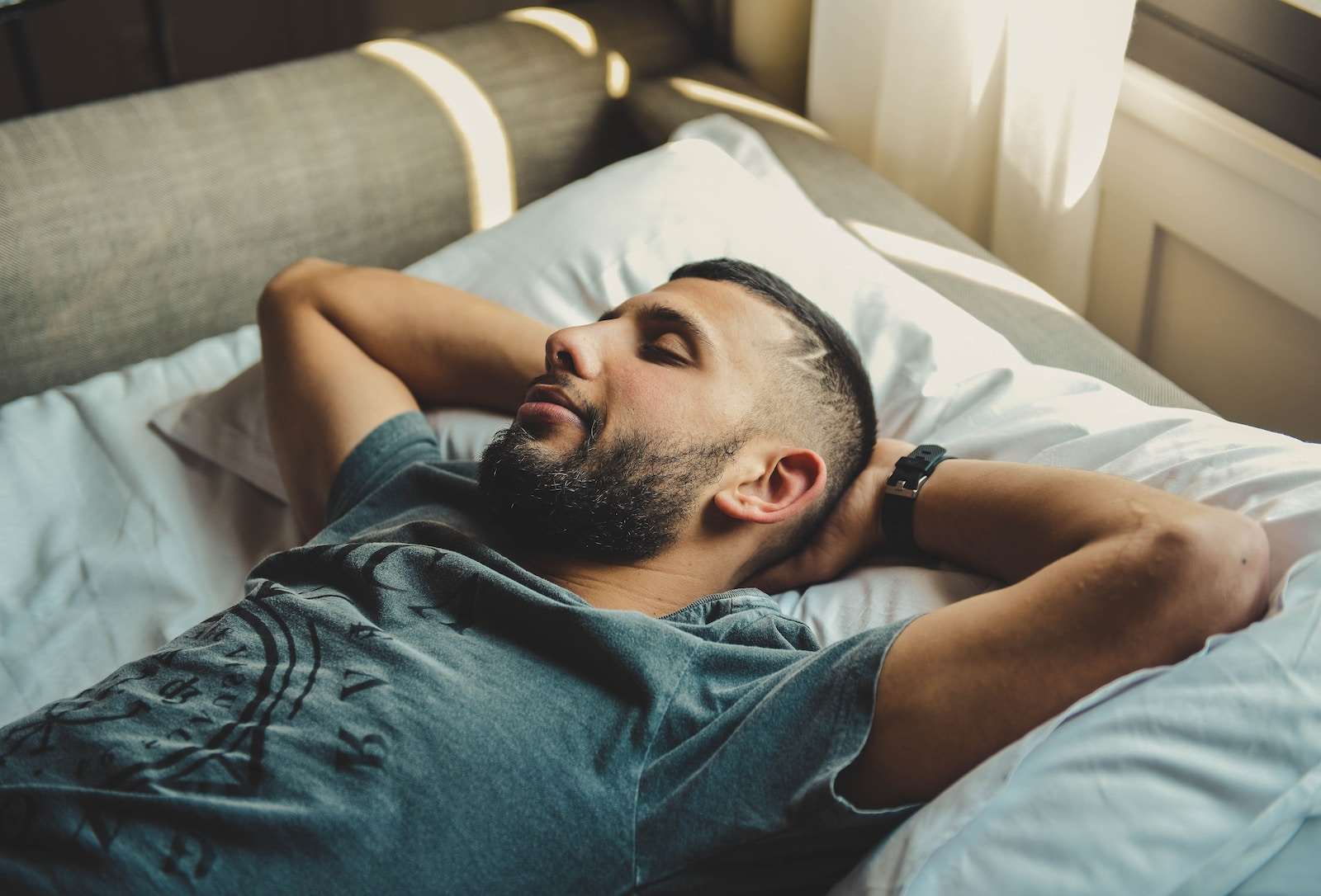 Photo by Tânia Mousinho man lying on bed