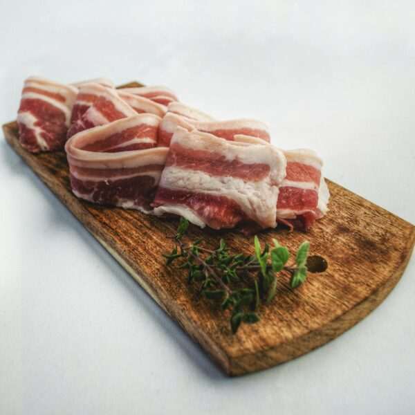 What Should I Expect On A Carnivore Diet? 30 Food Photography of Sliced Bacon on Top of Brown Chopping Board