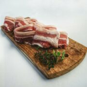 Food Photography of Sliced Bacon on Top of Brown Chopping Board