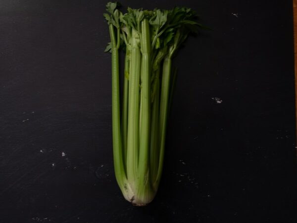 green vegetable on black table